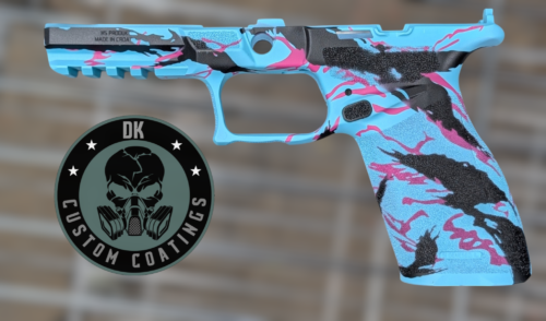 Side view of a turquoise camo handgun with pink and black accents, positioned above a circular DK Customs logo.